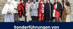 historisch verkleidete Menschen vor der schwarzen Bastion in Merseburg