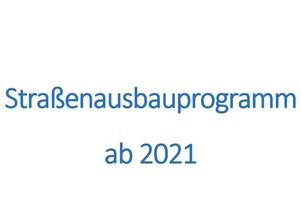 Auf dem Bild stehen Sie das Merseburger Straßenausbauprogramm ab 2021 mit dem Stadtwappen.
